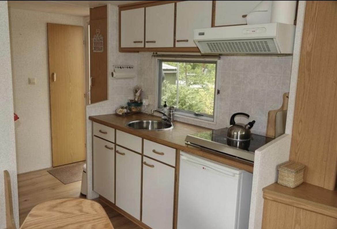 Tiny House In De Wei Hotel โฮลเตน ภายนอก รูปภาพ